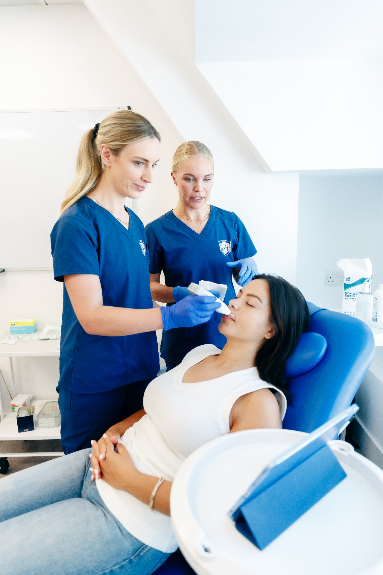 Clinicians assessing a patient at the Complications Clinic